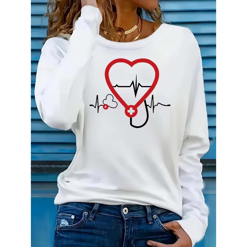 Stethoscope - 聴診器と心電図のプリントが施された、カジュアルな長袖Tシャツ。ゆったりとしたシルエットで、普段使いやオフィスカジュアルに最適な、女性向けのファッショントップス。快適で洗練されたデザイン。